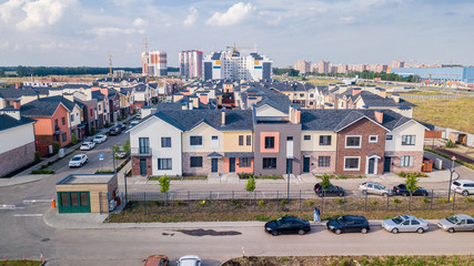House building cottage village and city construction concept: evening outdoor urban view of modern real estate homes