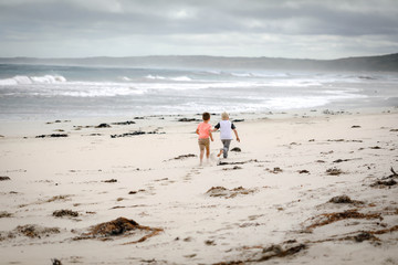 children running on the beach