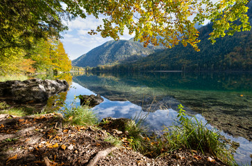 Peaceful autumn Alps mountain lake with clear transparent water and reflections. Langbathseen lake, Upper Austria.