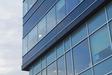 Fototapeta na wymiar office tower blue building corner glass windows skyscraper architecture