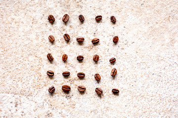 Fototapeta na wymiar Coffee Bean food knolling laid out in rows 