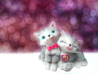 valentine's day card with cats couple toys on bokeh background