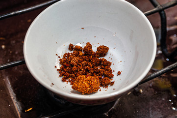 Spices at the bottom of a small white ceramic bowl
