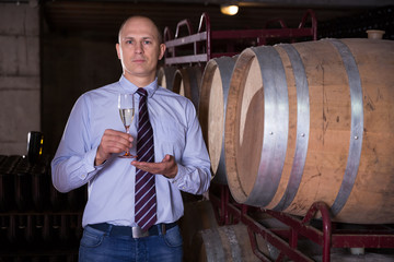 Winemaker inviting to wine degustation