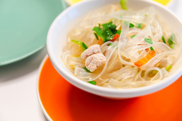 Soup with cellophane noodles, chicken and sweet green pepper.