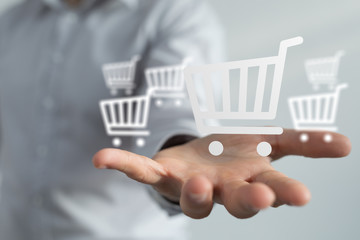 Businessman pressing modern technology panel shopping cart web phone credit card.