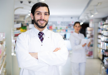 male pharmacist  on his work place
