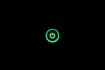 Neon green glowing power button, centered, isolated on black background.