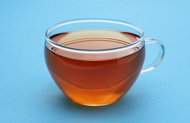 Cup of tea on a blue background.