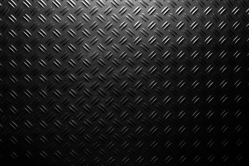 black checker plate background texture with light spot