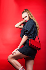 young pretty woman young lady posing on red background, lifestyle people concept