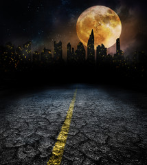 city lights in night and old road with full moon