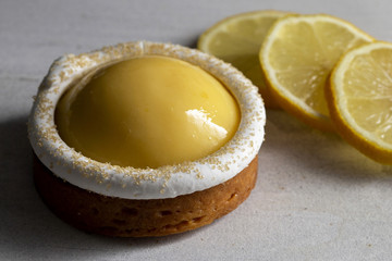 Lemon meringue tart with slices of fresh lemon