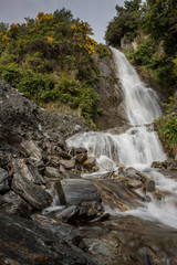 Naklejka na ściany i meble Waterfall at Mount Aspiring National Park. Haast highway 6. Westcoast New Zealand.