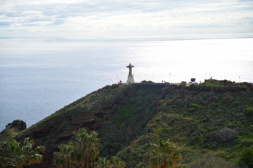 Fototapeta na wymiar Statue of Jesus on the ocean in Madeira