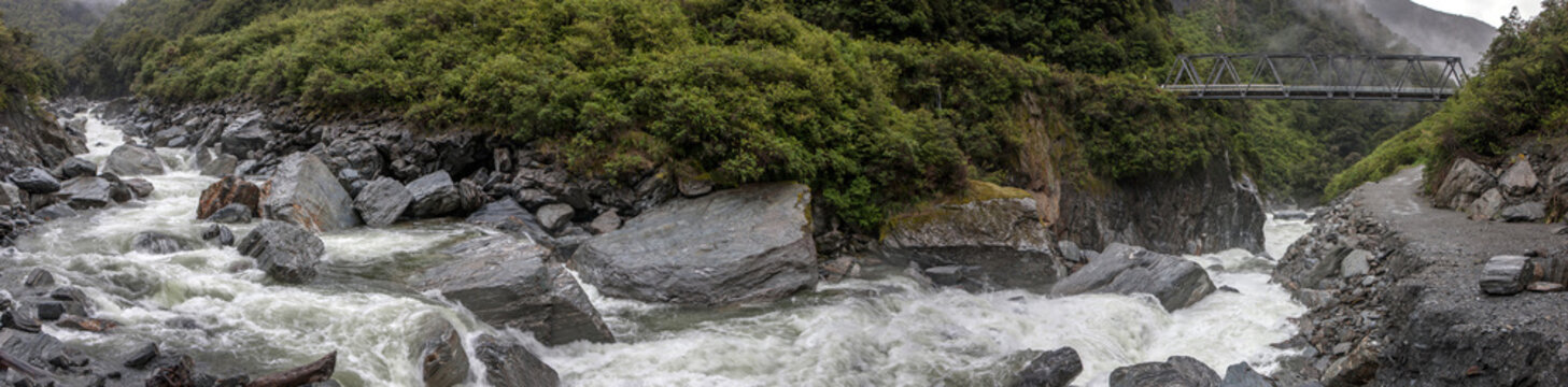 Panorama. Stream. Creek. Rocks. Fast streaming water. Mount Aspiring National Park. Haast highway 6. Westcoast New Zealand.