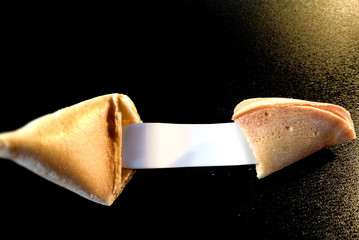 open fortune cookie with a blank note for your message