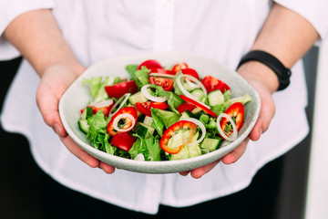 Vegetarian salad with tomatoes, cucumber and sweet pepper