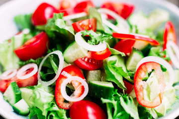 Vegetarian salad with tomatoes, cucumber and sweet pepper