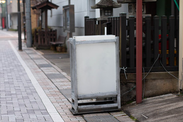 Blank Japanese style sign board in front of a house.