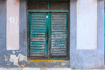 Old green door of a house in Havana, Cuba