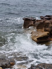 waves crashing on rocks