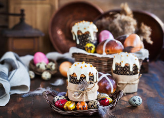 Holiday Easter cakes, hot cross buns and colorful painted eggs