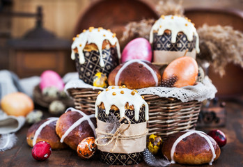 Holiday Easter cakes, hot cross buns and colorful painted eggs