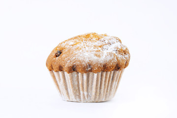 Cupcake with raisins with icing on a white background