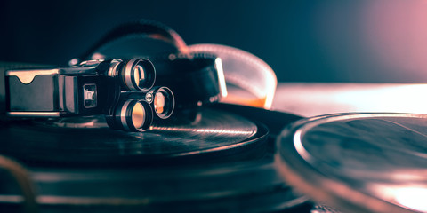 Film projector on dark background. Close up of old retro things shoot with vintage style colors and...