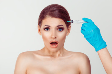 Fototapeta premium Woman afraid shocked of filler botulinum toxin injection hyaluronic acid shot anti wrinkles aesthetic surgery, isolated white background
