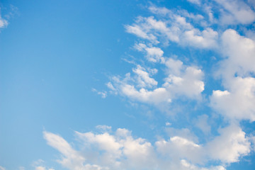 Bright blue sky with white clouds for background or wallpapers