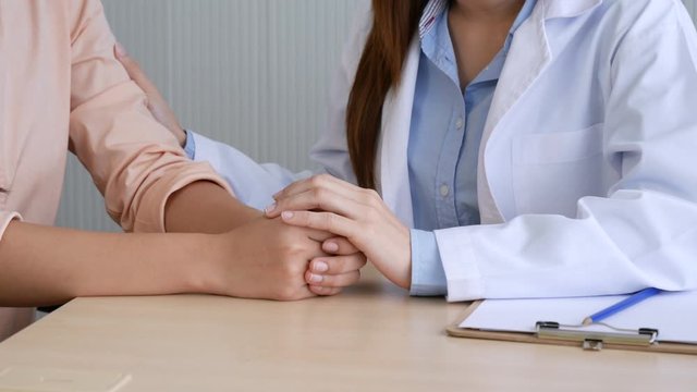 Woman doctor and patient consultation with professional specialist diagnostics at hospital medicare treatment clinic. Doctor writing prescription for medical health care therapy. 