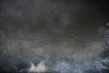 The atmosphere is fog and smoke. The background is a concrete texture. Suitable for creating background images.