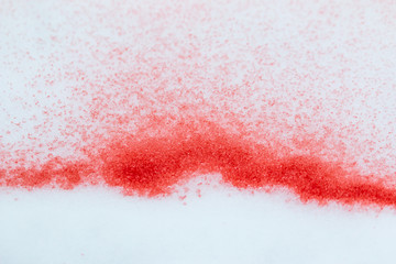 spots of red paint on white snow