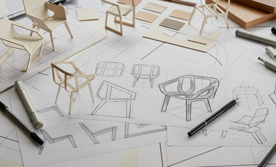 Designer sketching drawing design development product plan draft chair armchair Wingback Interior furniture prototype manufacturing production. designer studio concept . © Chaosamran_Studio