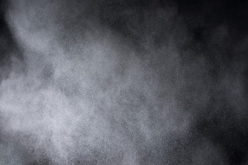 Explosion of colored powder isolated on black background. Abstract colored background. holi festival.