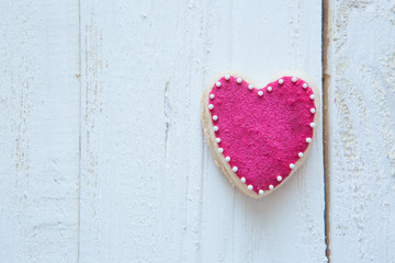 Valentine heart cookie on white wooden background