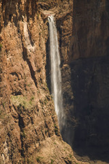 view of majestic waterfall flowing off the clips