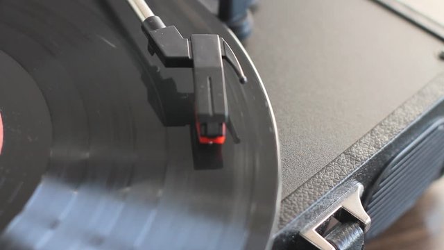playing a music record on a portable player, top view