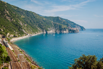 Fototapeta na wymiar Aerial view of Corniglia train station, Cinque Terre, Italy. Railway along the picturesque Italian coast.