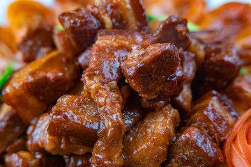 Overhead of dinner table. Barbecue meat and seafood with vegetable. Pork grilled steaks, grilled salmon trout, mussels, shrimps, dried tomato, cherry tomato, glass of wine. Picnic bbq party concept.