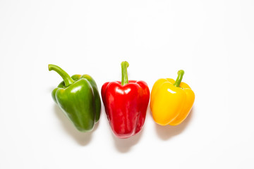 Set of colorful green yellow and red sweet chilli pepper on white background