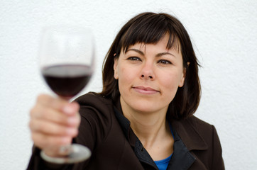 Woman Holding Up a Glass of Red Wine.
