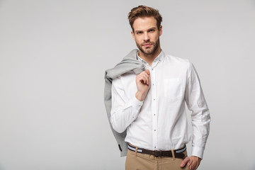 Portrait of confident young man posing on camera with jacket