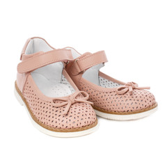 Pink shoes for girls with a bow isolated on white