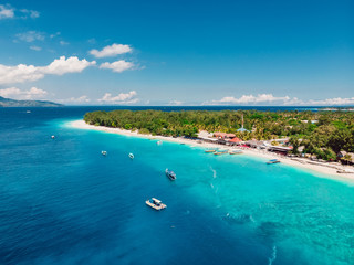 Fototapeta na wymiar Tropical island with paradise beach and turquoise sea. Aerial view.