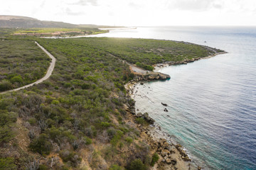 Aerial view of coast of Curaçao in the Caribbean Sea with turquoise water, cliff, beach and...
