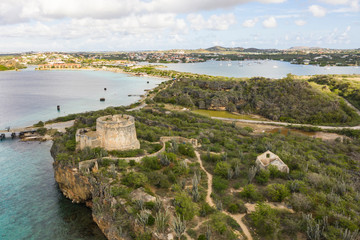 Aerial view of coast of Curaçao in the Caribbean Sea with turquoise water, cliff, beach and...