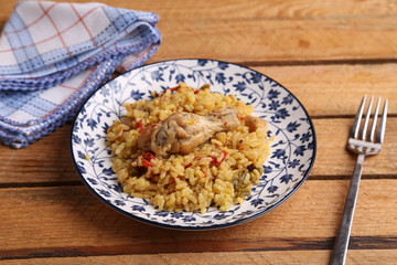 plate of rice with chicken and peppers